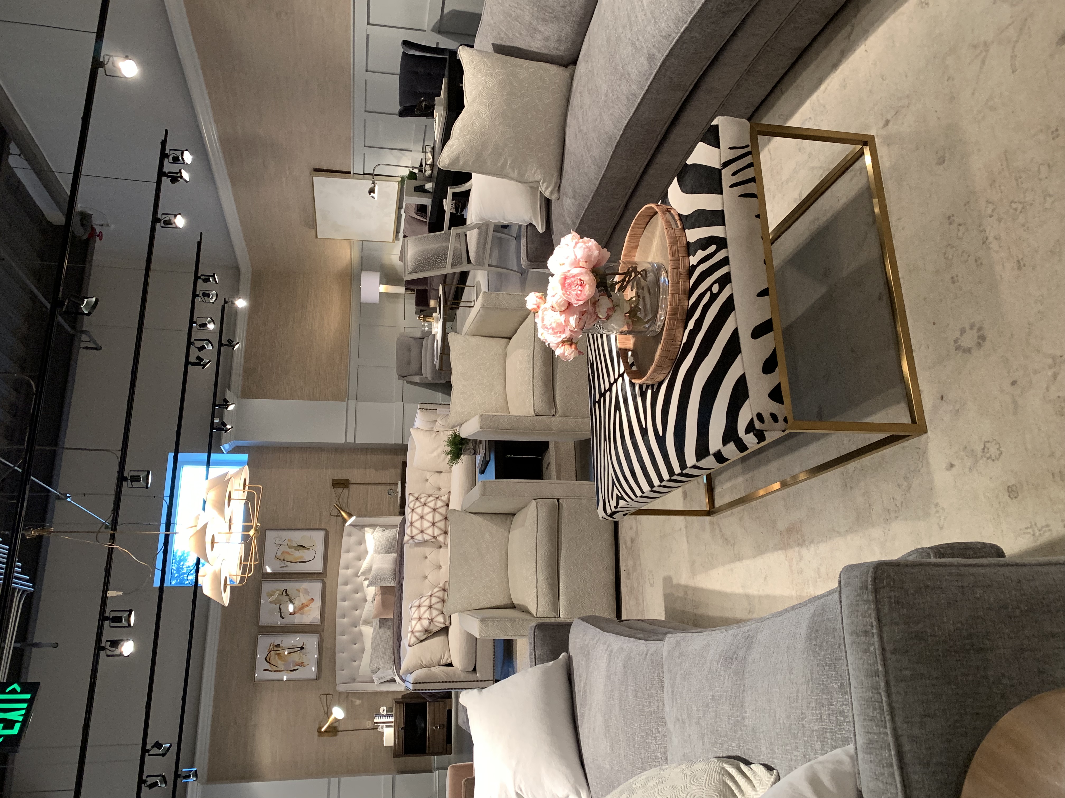 Neutral colored sofa with zebra print coffee table 