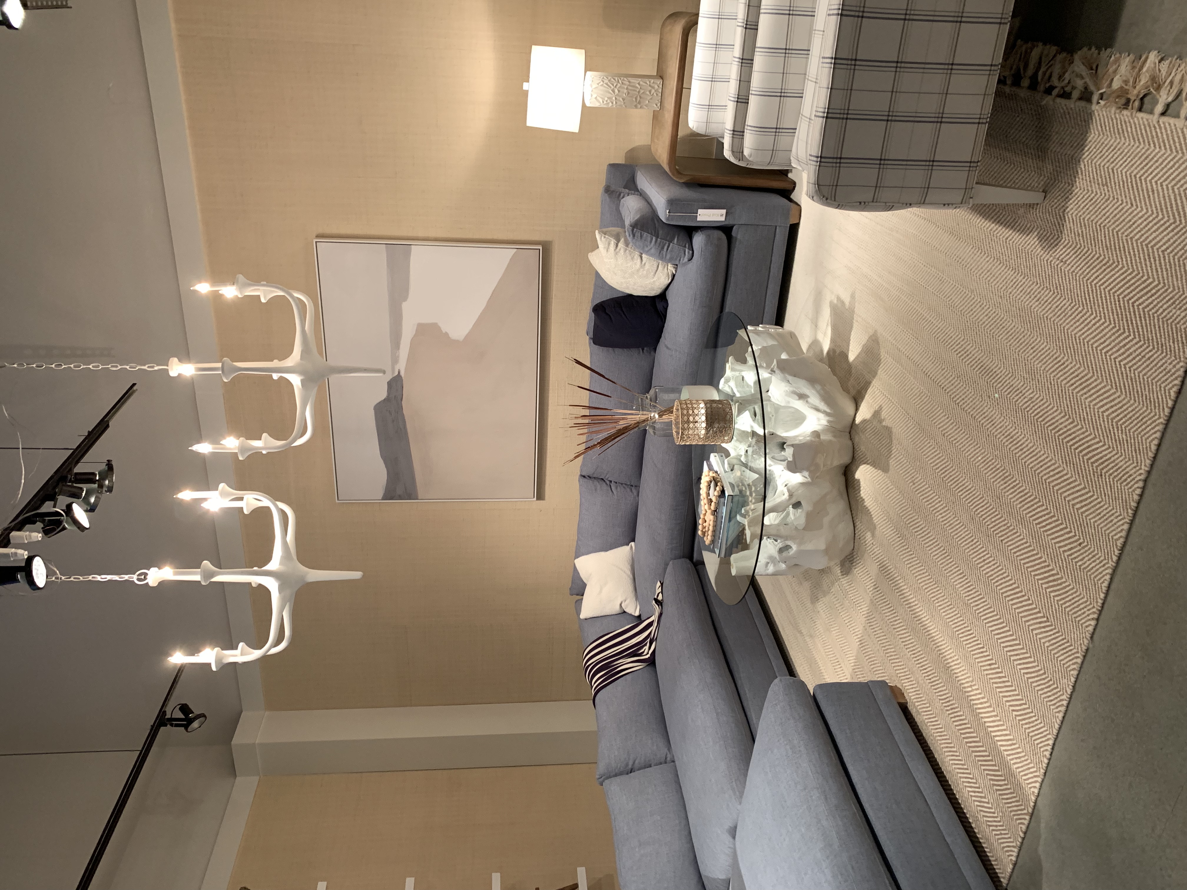 blue coastal sectional with navy and white chairs