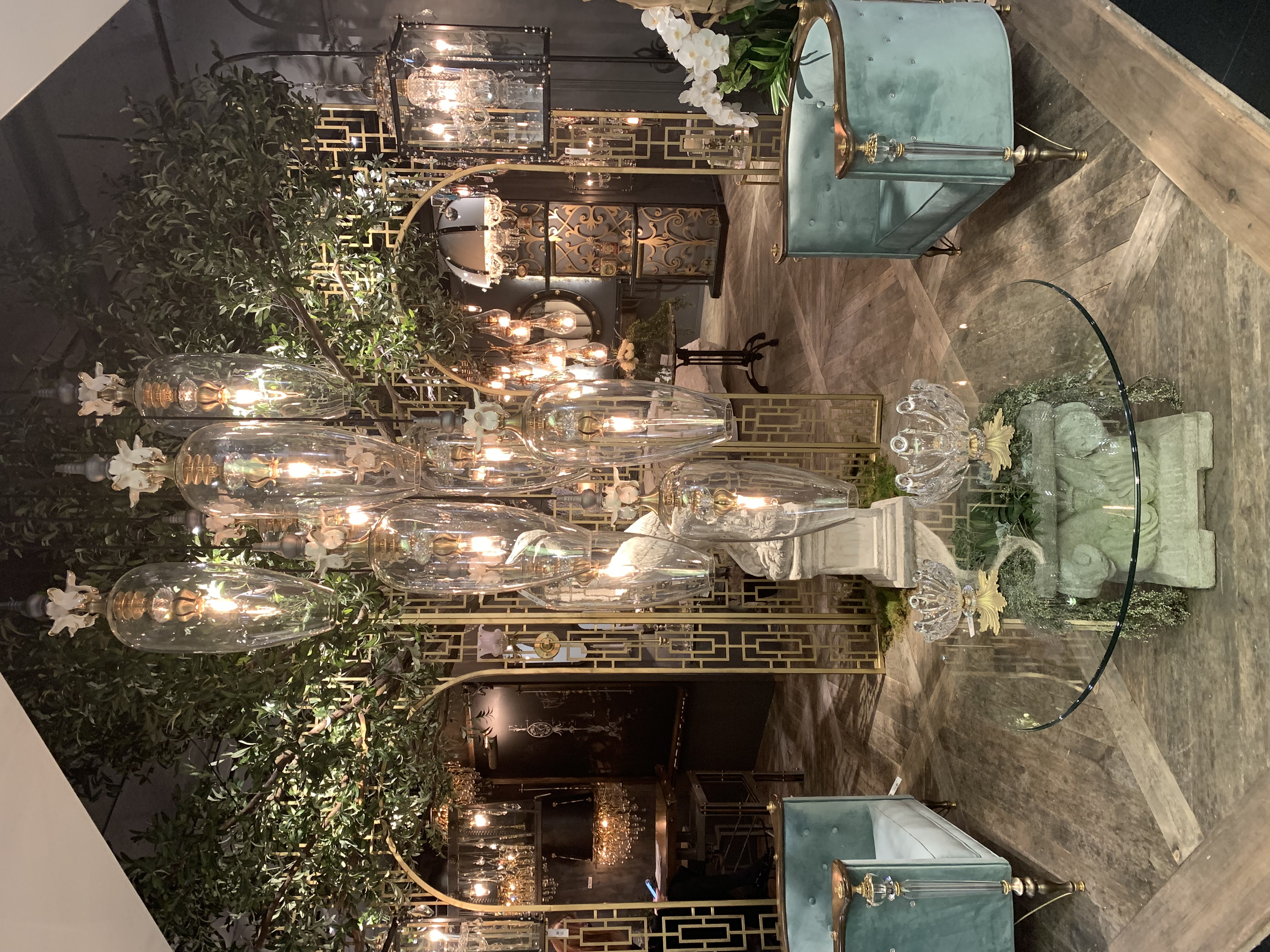 large glass chandelier with blue side chairs
