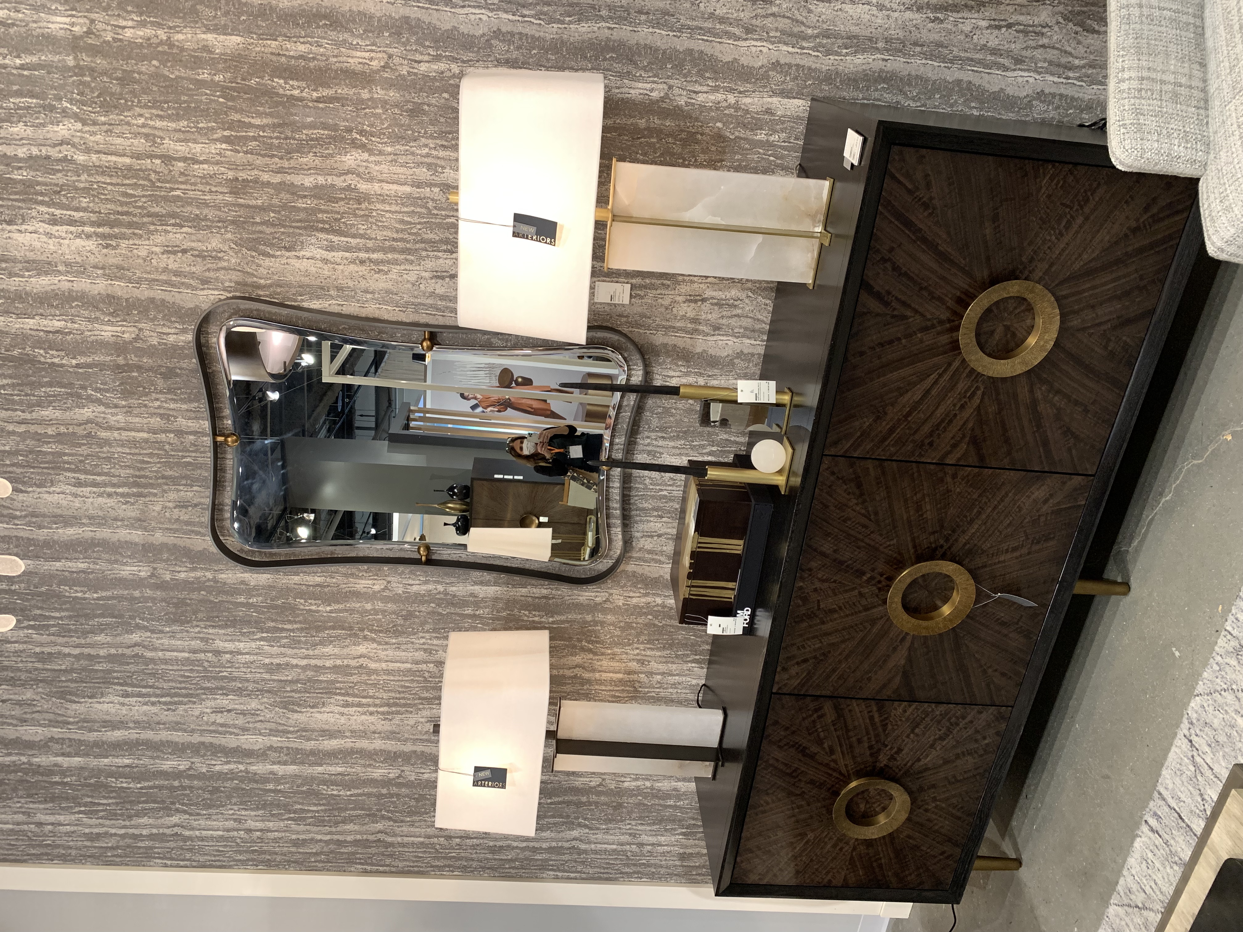 brown console table with large circular hardware