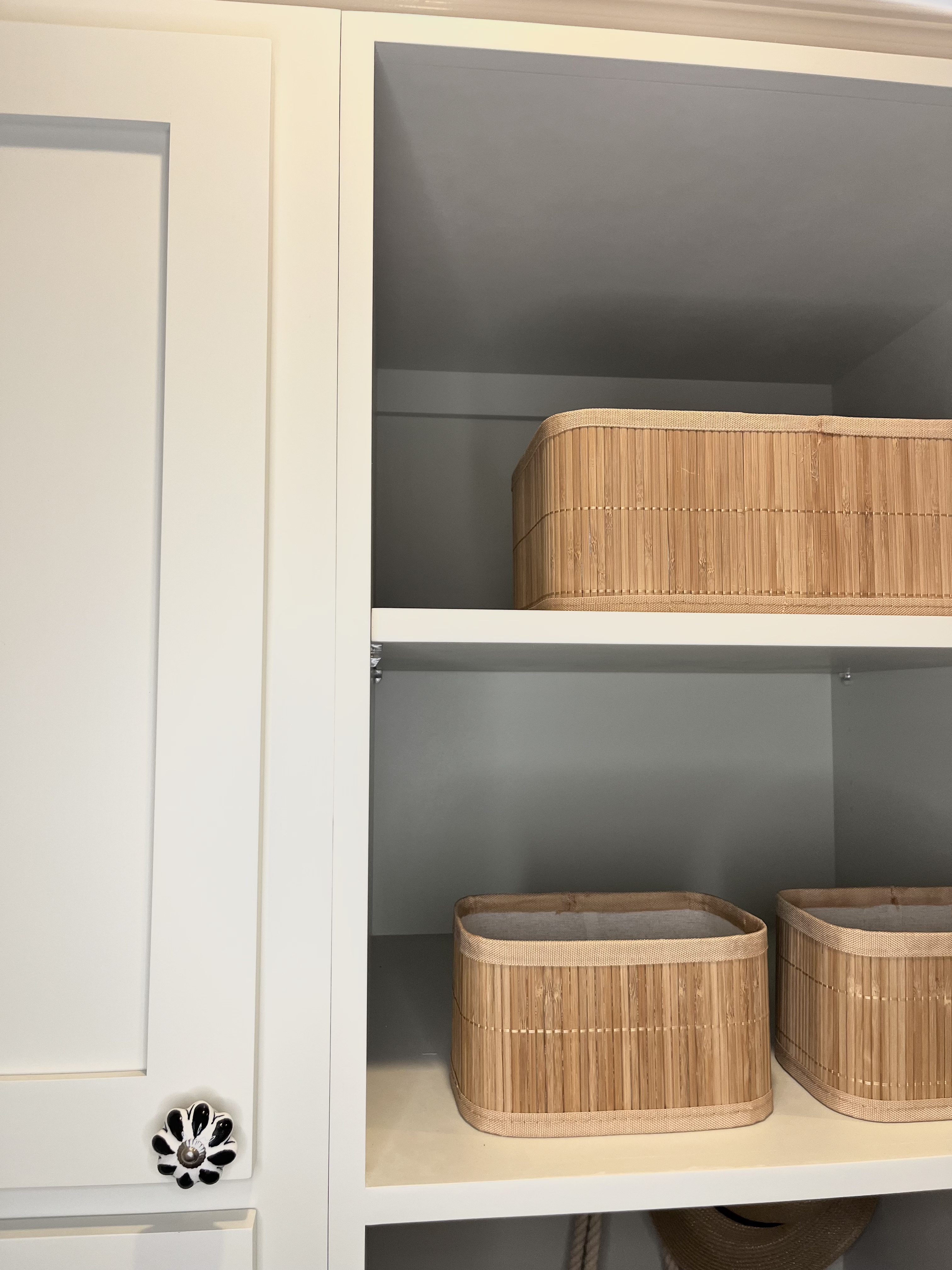 green cabinets with black and white knobs