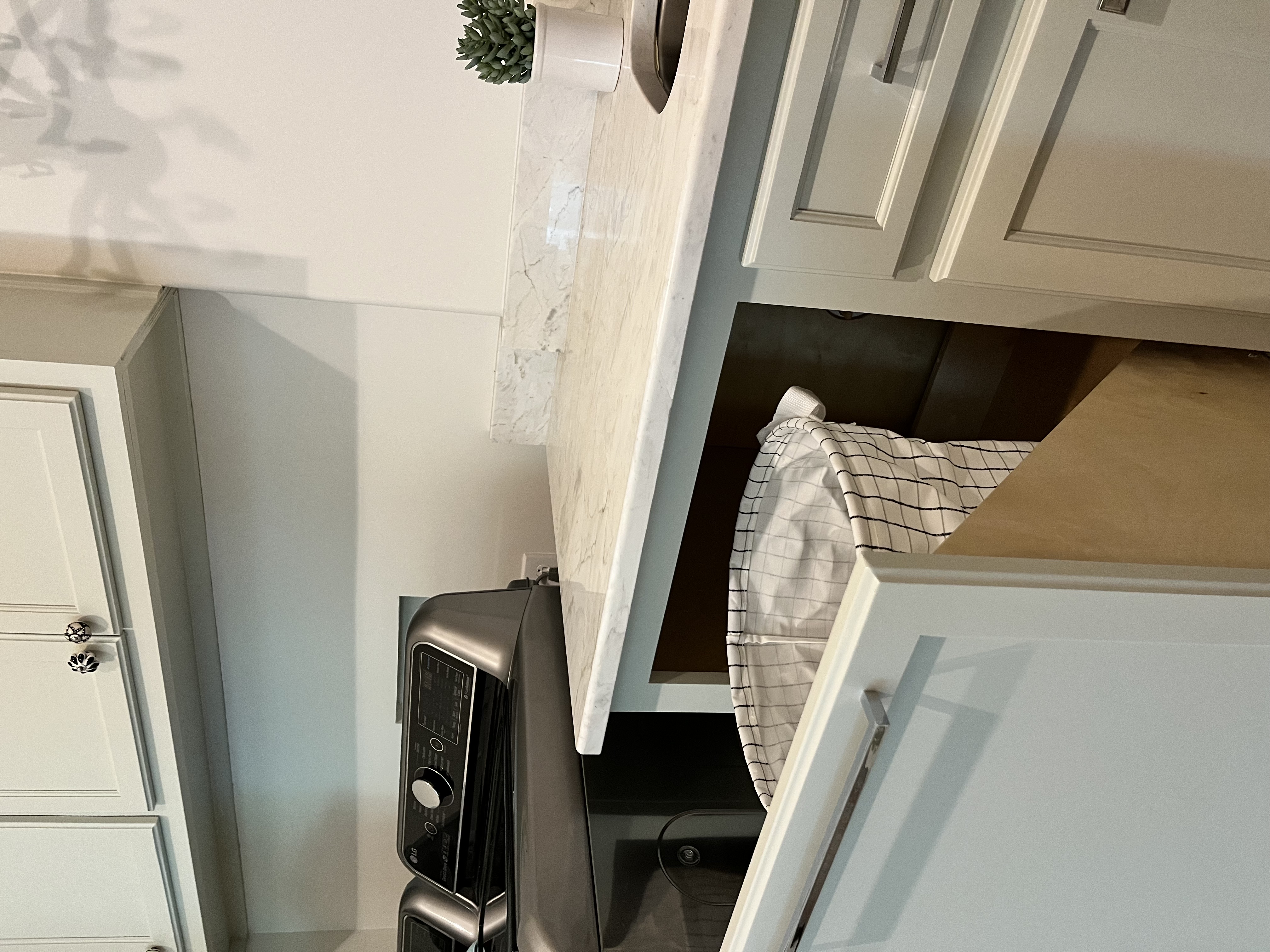 hidden laundry room basket storage