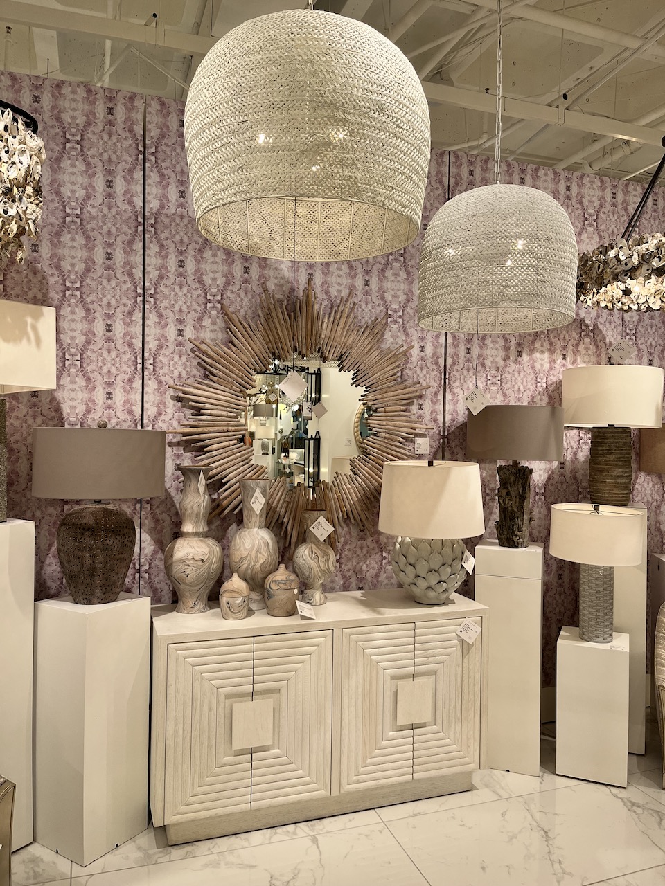Oversize rattan pendant lights with purple wallpaper