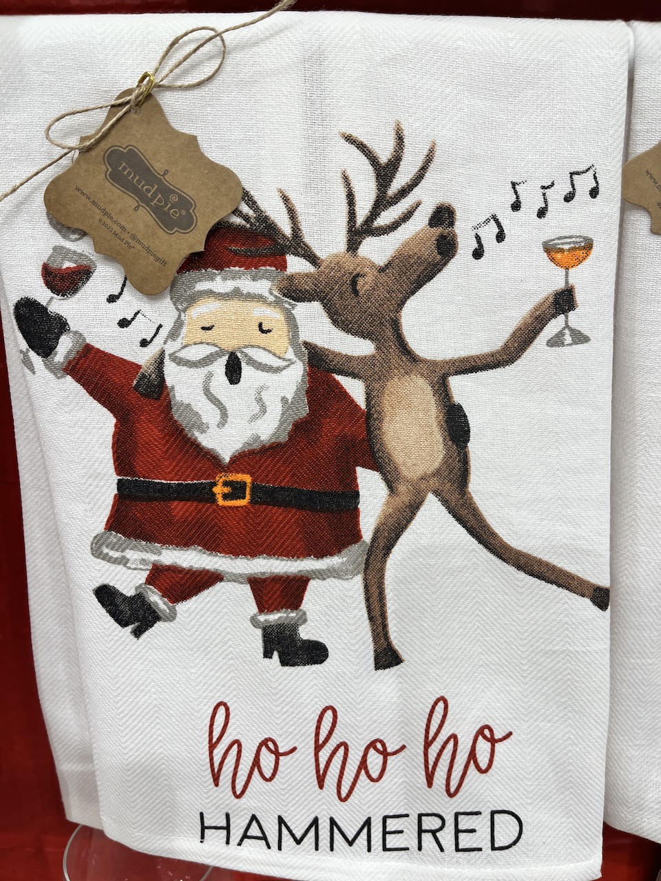 Santa tea towel that says ho ho ho hammered