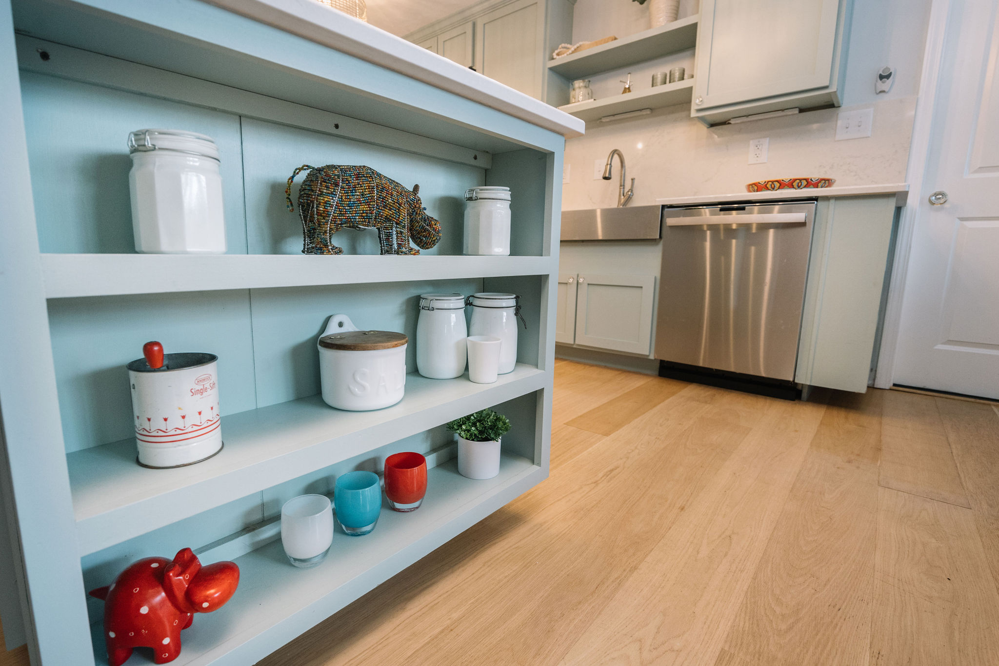 COASTAL KITCHEN WITH BLUE CABINETS AND OPEN SHELVES