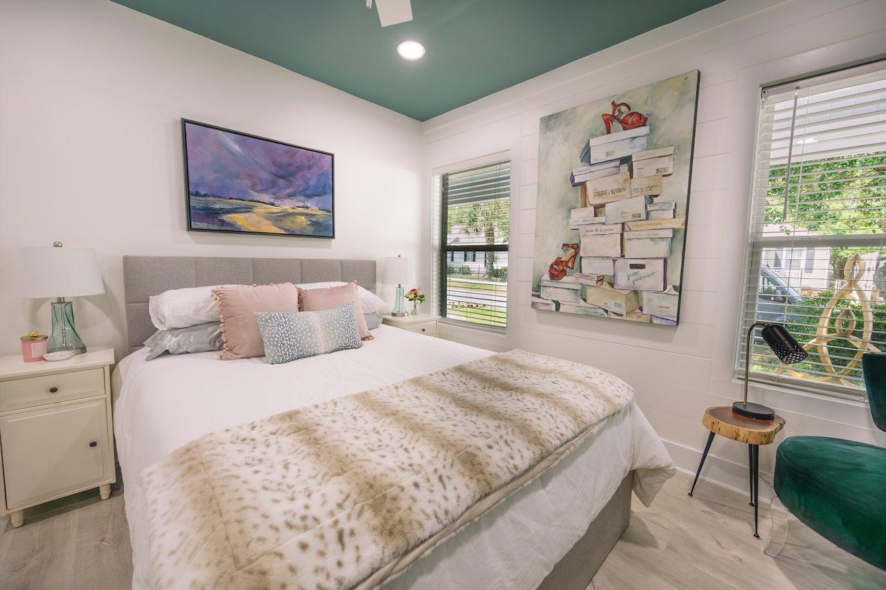 guest bedroom with green ceiling and white walls