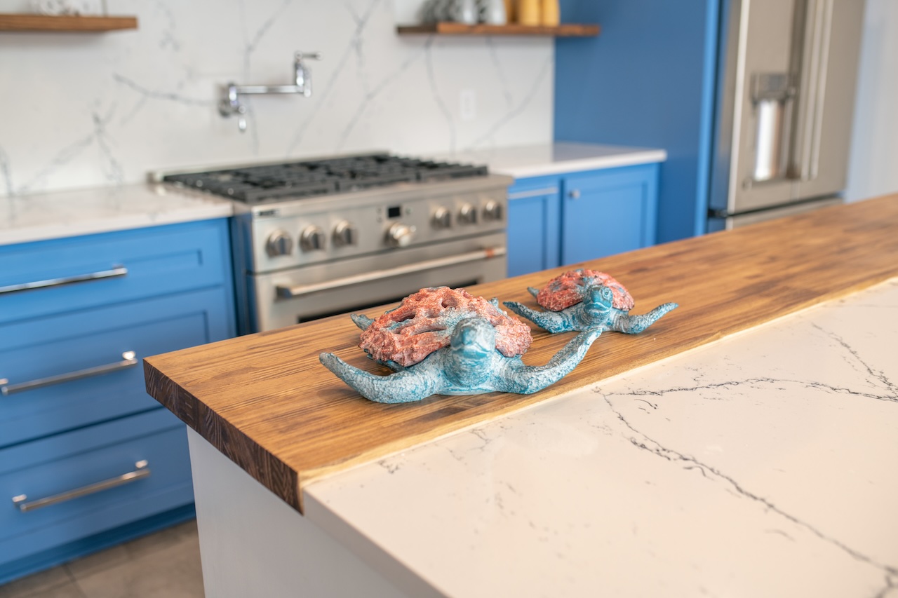 quartz countertop with butcher block piece